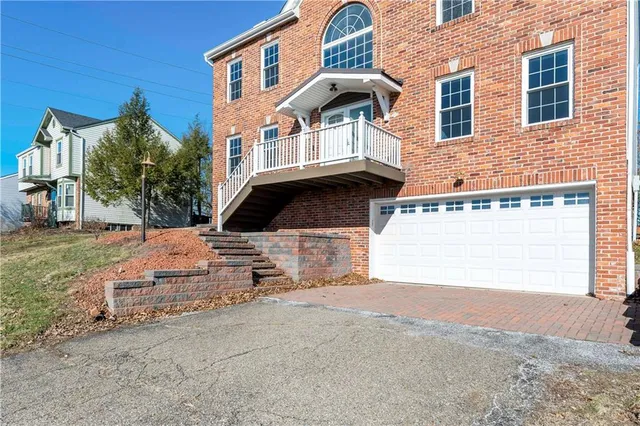 an aerial view of a house with a outdoor space