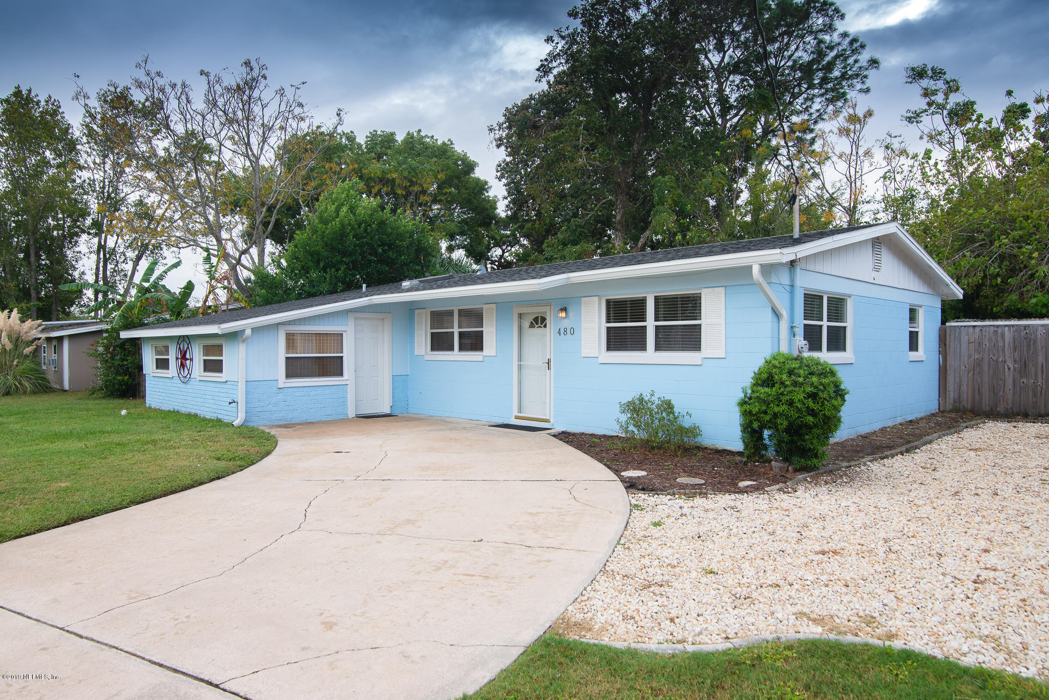 480 Irex Road Atlantic Beach, FL 32233 - Photo 2 of 26 a front view of a house with a yard