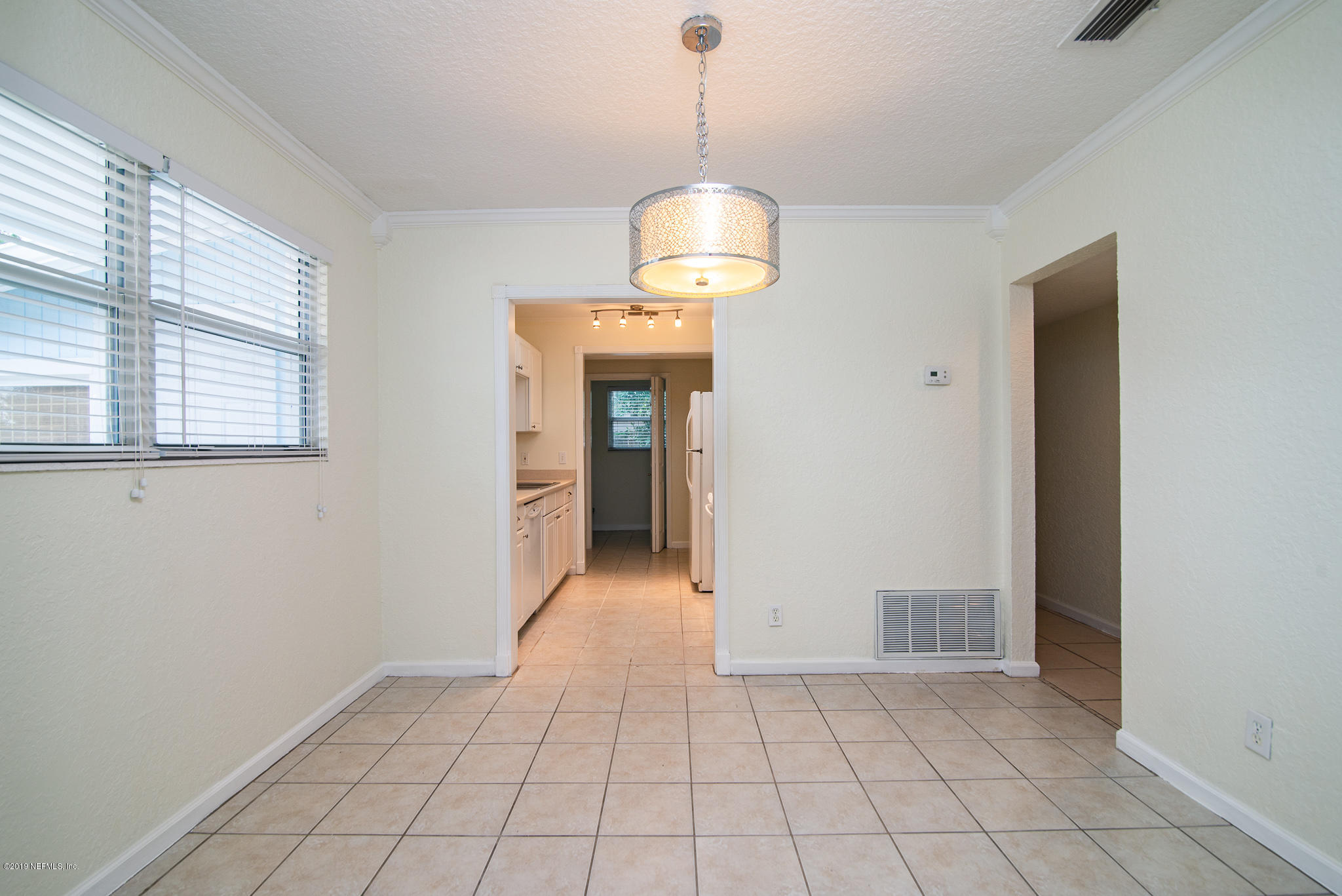 480 Irex Road Atlantic Beach, FL 32233 - Photo 8 of 26 a view of a room with an entryway and chandelier