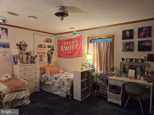 a bed room with furniture and a window