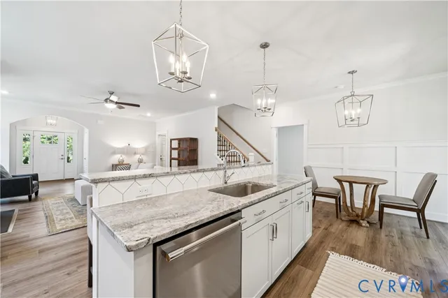 an open kitchen with a table and chairs in it