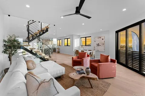 a living room with furniture or window and a wooden floor