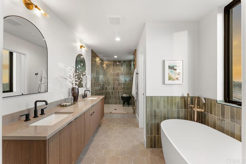 4224 Tonopah Avenue San Diego, CA 92110 - Photo 17 of 38 a spacious bathroom with a bathtub shower sink mirror and toilet