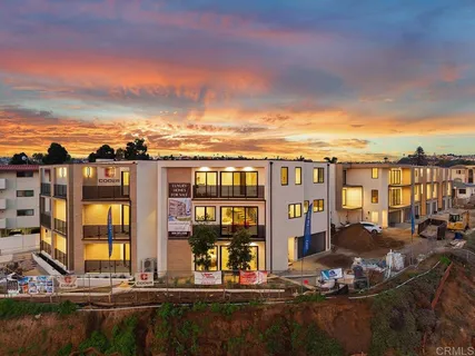 a view of tall buildings and lake view
