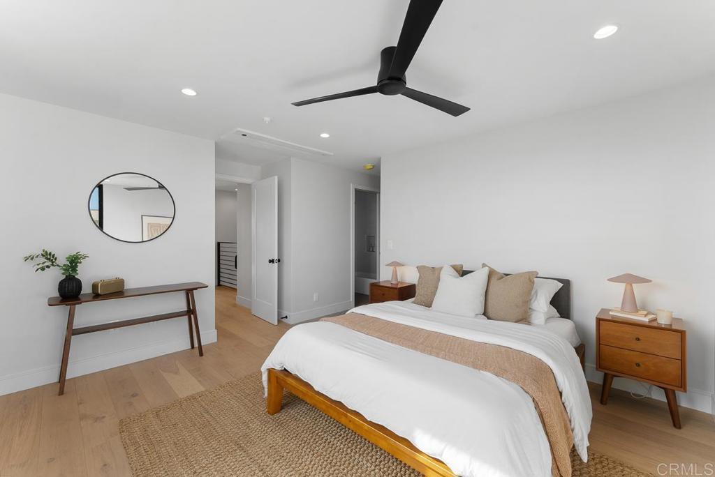 4224 Tonopah Avenue San Diego, CA 92110 - Photo 20 of 38 a bedroom with a bed chandelier and a window