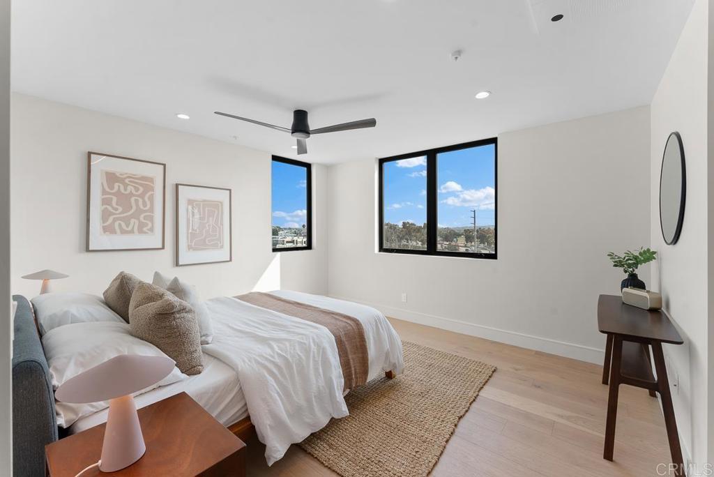 4224 Tonopah Avenue San Diego, CA 92110 - Photo 21 of 38 a bedroom with a bed and a painting on the wall