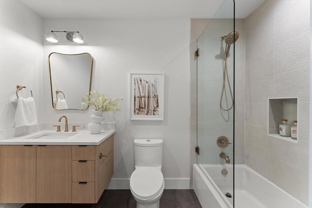 4224 Tonopah Avenue San Diego, CA 92110 - Photo 22 of 38 a bathroom with a sink toilet vanity and shower