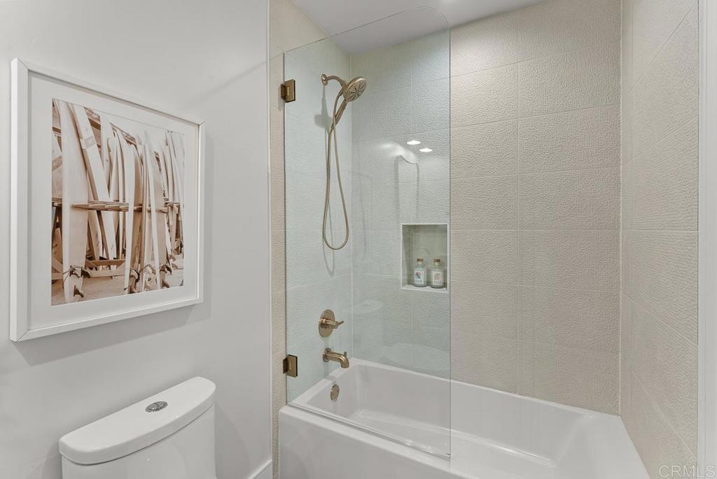 4224 Tonopah Avenue San Diego, CA 92110 - Photo 23 of 38 a bath room with a toilet a bath tub and a shower