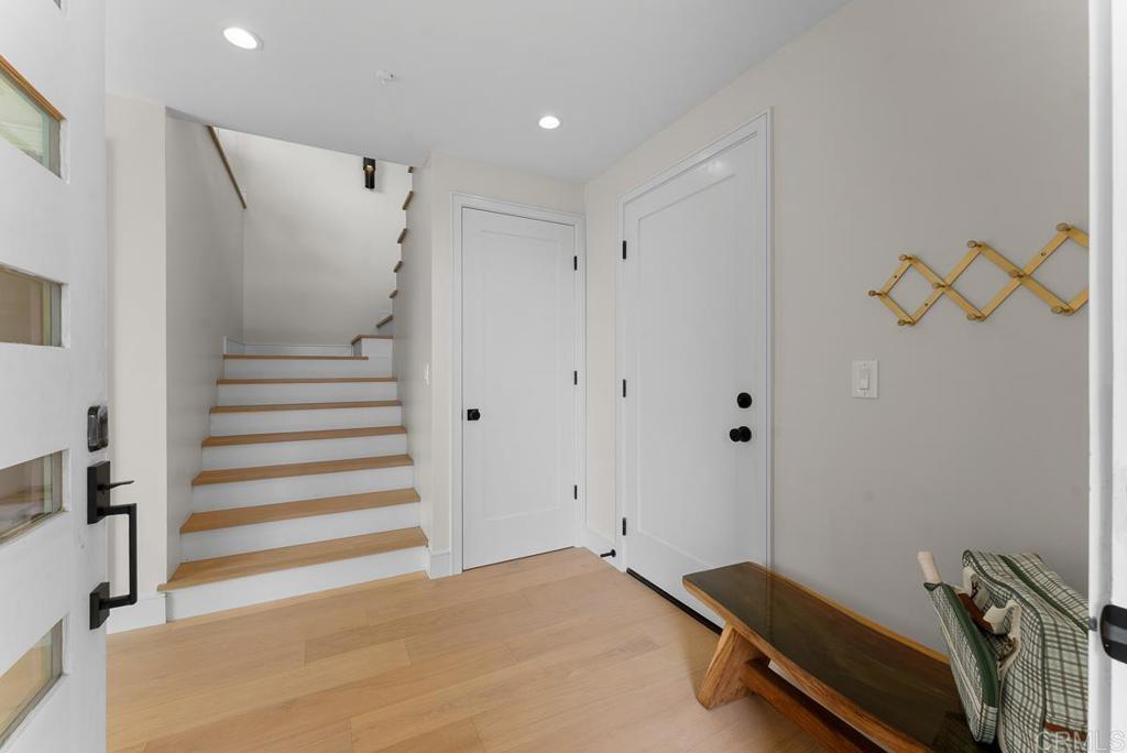 4224 Tonopah Avenue San Diego, CA 92110 - Photo 25 of 38 a view of room with stairs and wooden floor