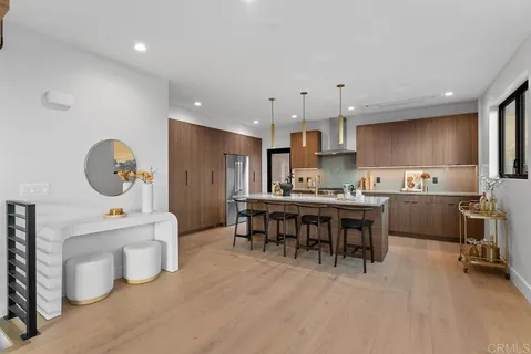 a kitchen with a sink stove top oven and cabinets