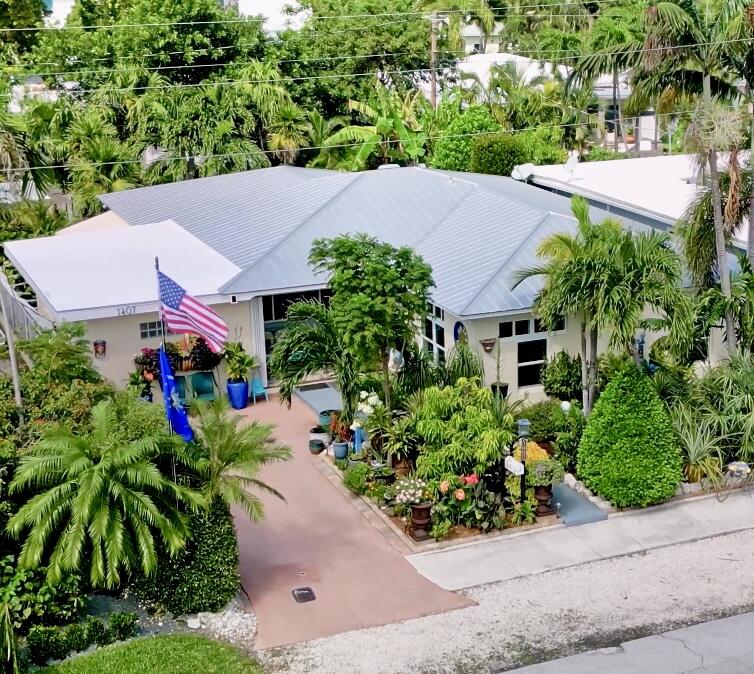 1407 Rose Street Key West, FL 33040 - Photo 1 of 74 an aerial view of a house with a yard and garden