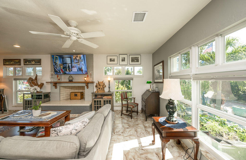 1407 Rose Street Key West, FL 33040 - Photo 17 of 74 a living room with fireplace furniture and a large window