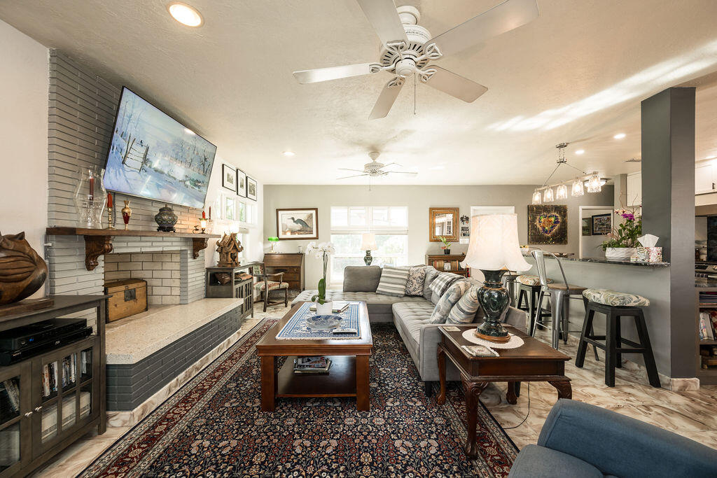 1407 Rose Street Key West, FL 33040 - Photo 18 of 74 a living room with fireplace furniture and a rug