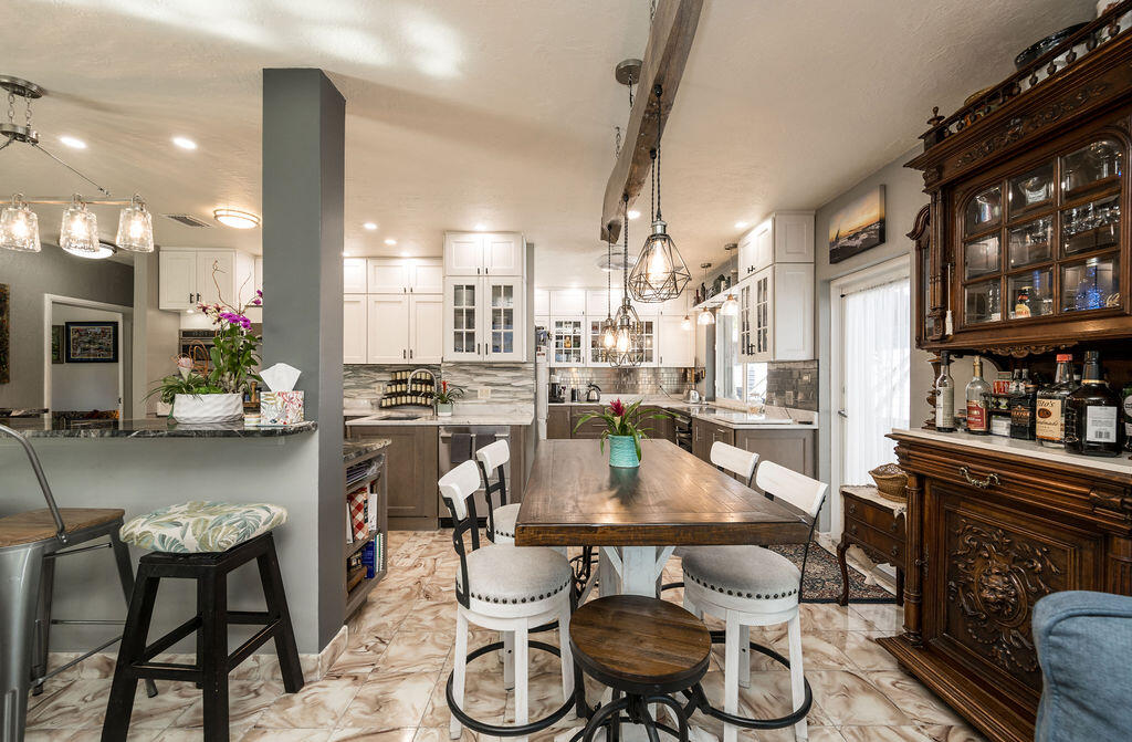 1407 Rose Street Key West, FL 33040 - Photo 23 of 74 a dining room with furniture a rug and wooden floor