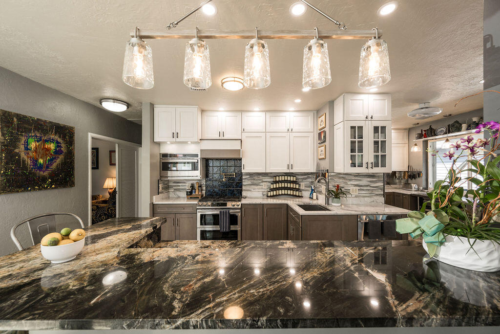 1407 Rose Street Key West, FL 33040 - Photo 35 of 74 a kitchen with lots of counter space and stainless steel appliances