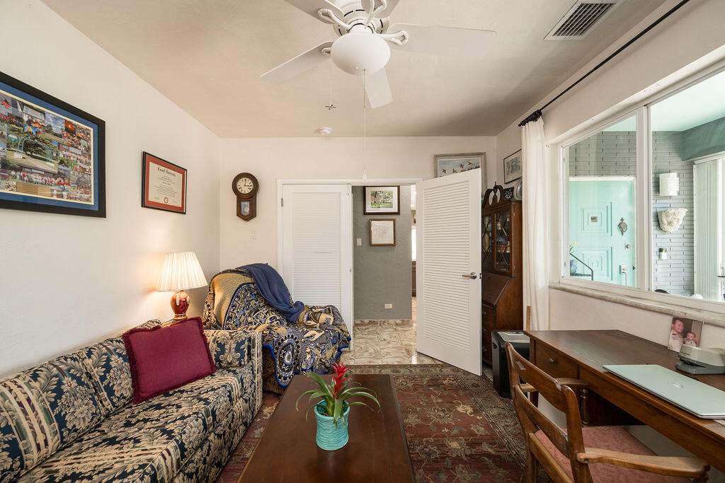 1407 Rose Street Key West, FL 33040 - Photo 37 of 74 a bedroom with bed and a mirror