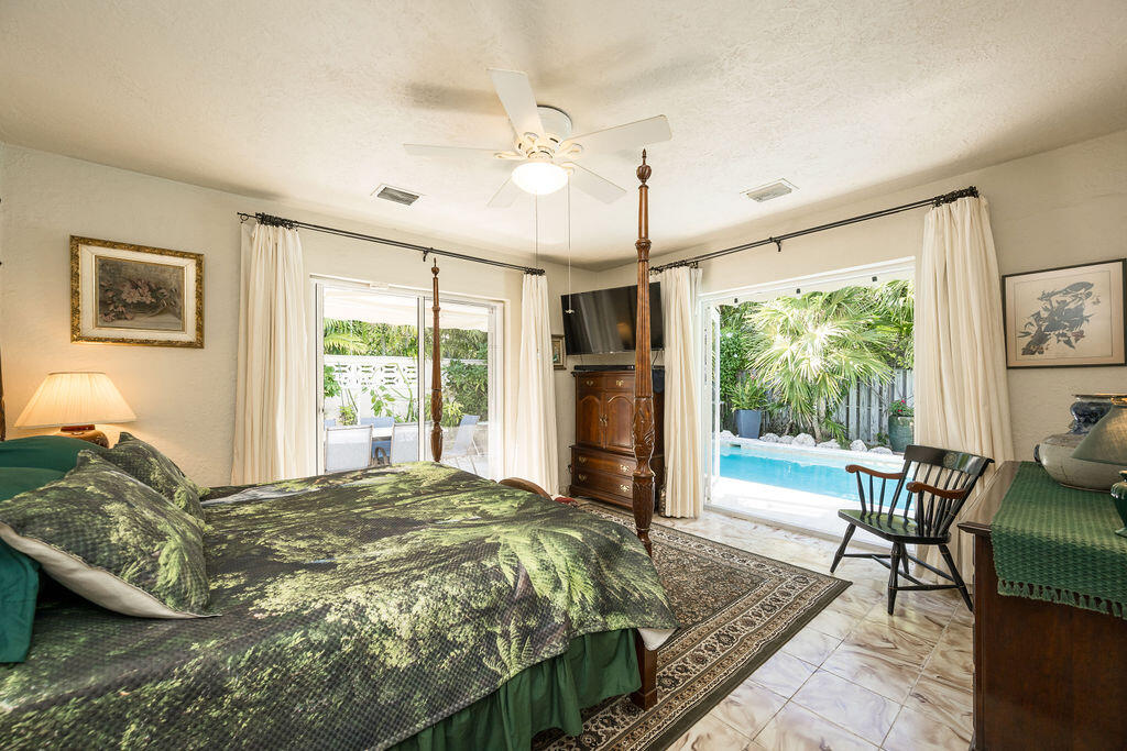 1407 Rose Street Key West, FL 33040 - Photo 40 of 74 a bed sitting in a bedroom next to a window