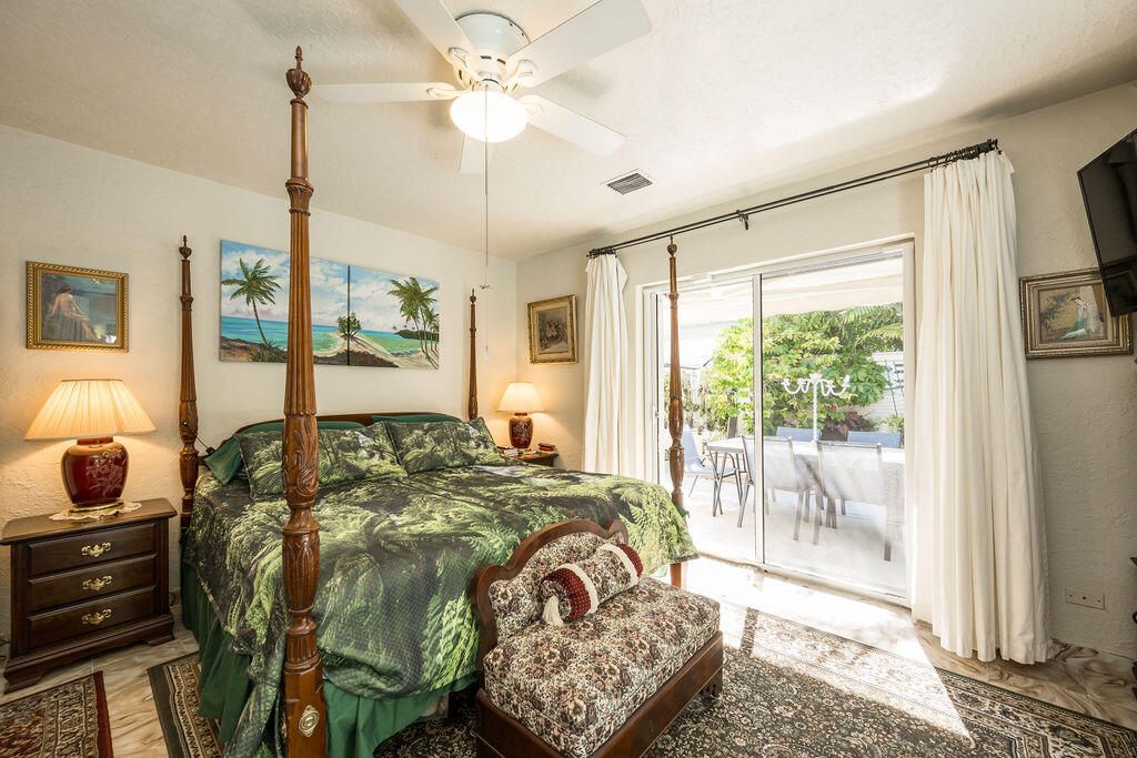 1407 Rose Street Key West, FL 33040 - Photo 41 of 74 a bed sitting in a bedroom next to a window