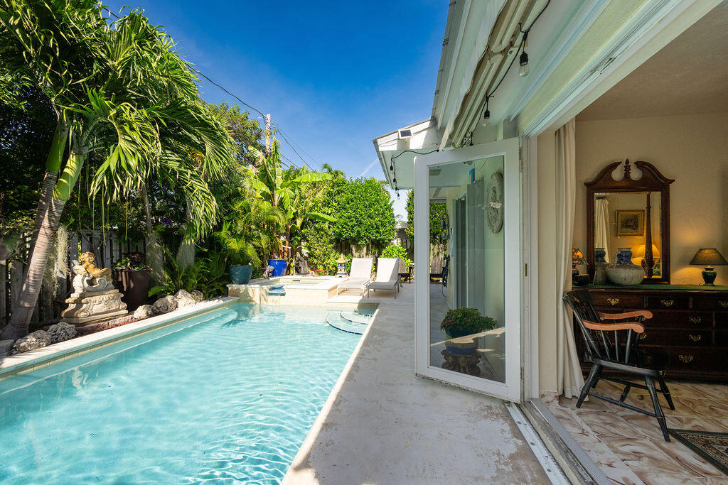 1407 Rose Street Key West, FL 33040 - Photo 49 of 74 a view of a house with backyard porch and patio