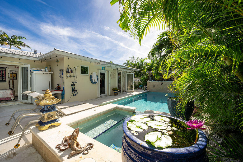 1407 Rose Street Key West, FL 33040 - Photo 58 of 74 a view of a chairs and table in backyard of the house