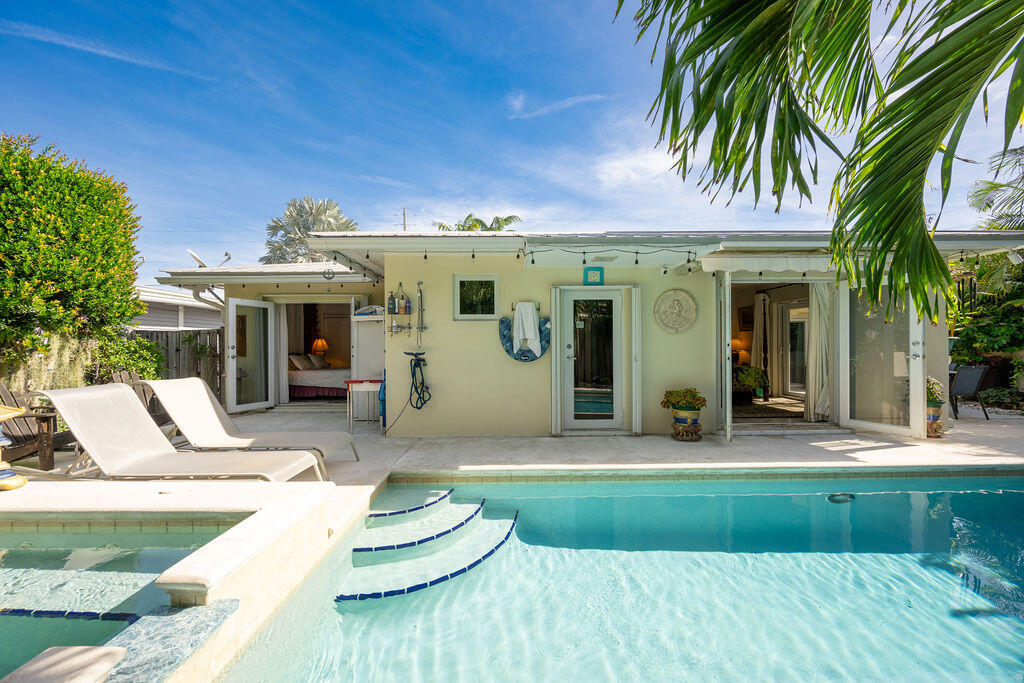 1407 Rose Street Key West, FL 33040 - Photo 63 of 74 a view of a white house with a yard patio and fire pit