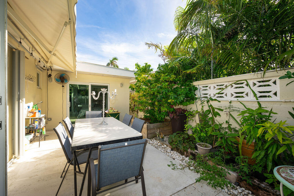 1407 Rose Street Key West, FL 33040 - Photo 66 of 74 a view of a patio with table and chairs and potted plants