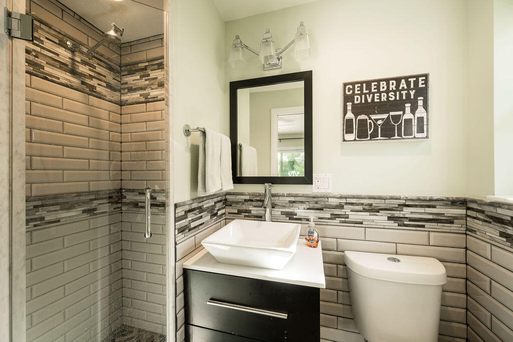 1407 Rose Street Key West, FL 33040 - Photo 72 of 74 a bathroom with a sink a toilet and shower