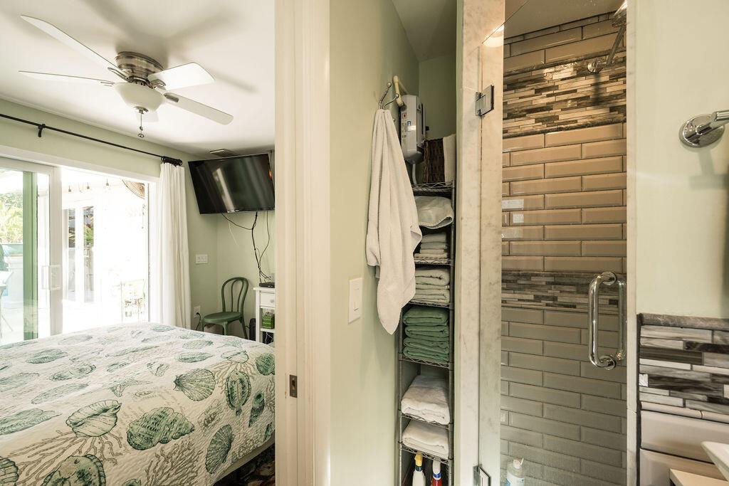 1407 Rose Street Key West, FL 33040 - Photo 73 of 74 a bedroom with a bed and a window