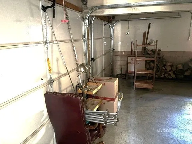 a view of a porch with furniture and a yard