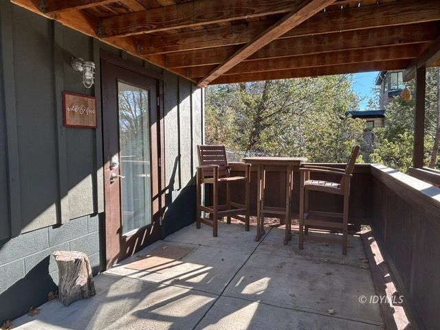 25405 Seneca Road Idyllwild, CA 92549 - Photo 21 of 27 a view of a porch with furniture and a yard