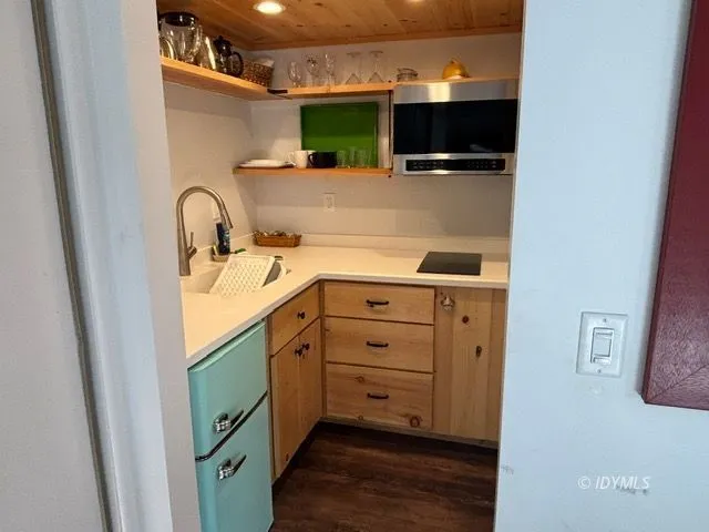 a bathroom with a sink and mirror