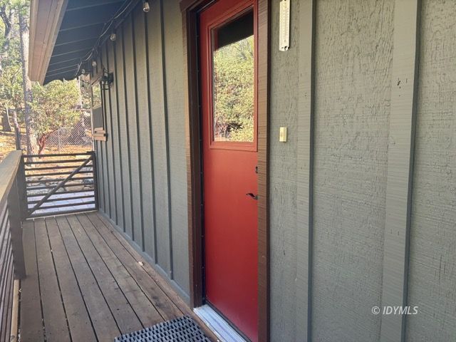 25405 Seneca Road Idyllwild, CA 92549 - Photo 3 of 27 a view of a balcony with wooden floor