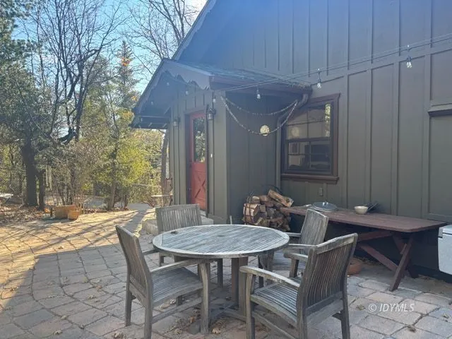 a outdoor dining space with furniture and outdoor view