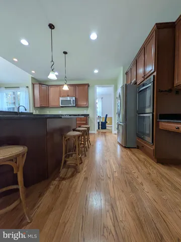 a living room with fireplace furniture and a flat screen tv