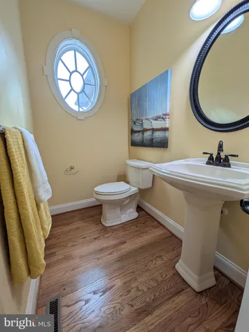 a bedroom with a bed window and couch