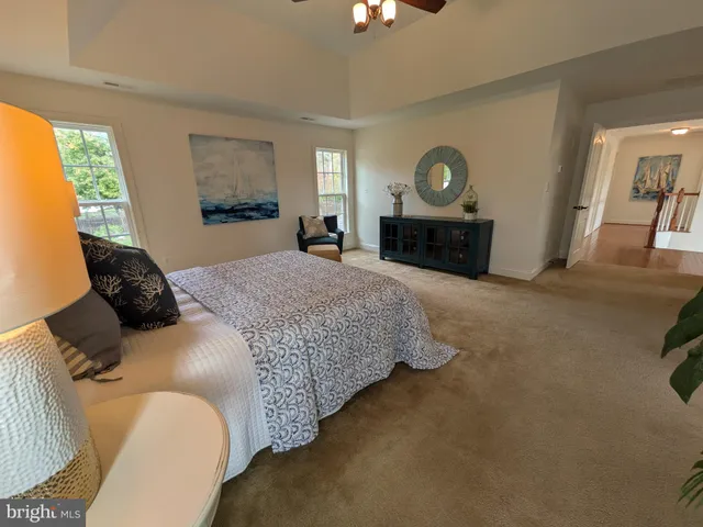 a bedroom with furniture and a window