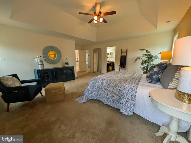 a room with a table chairs and entryway