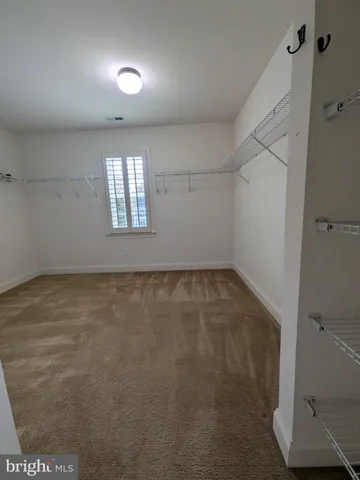 a kitchen with granite countertop cabinets and steel stainless steel appliances
