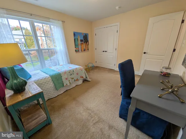 a view of a house with a yard and plants