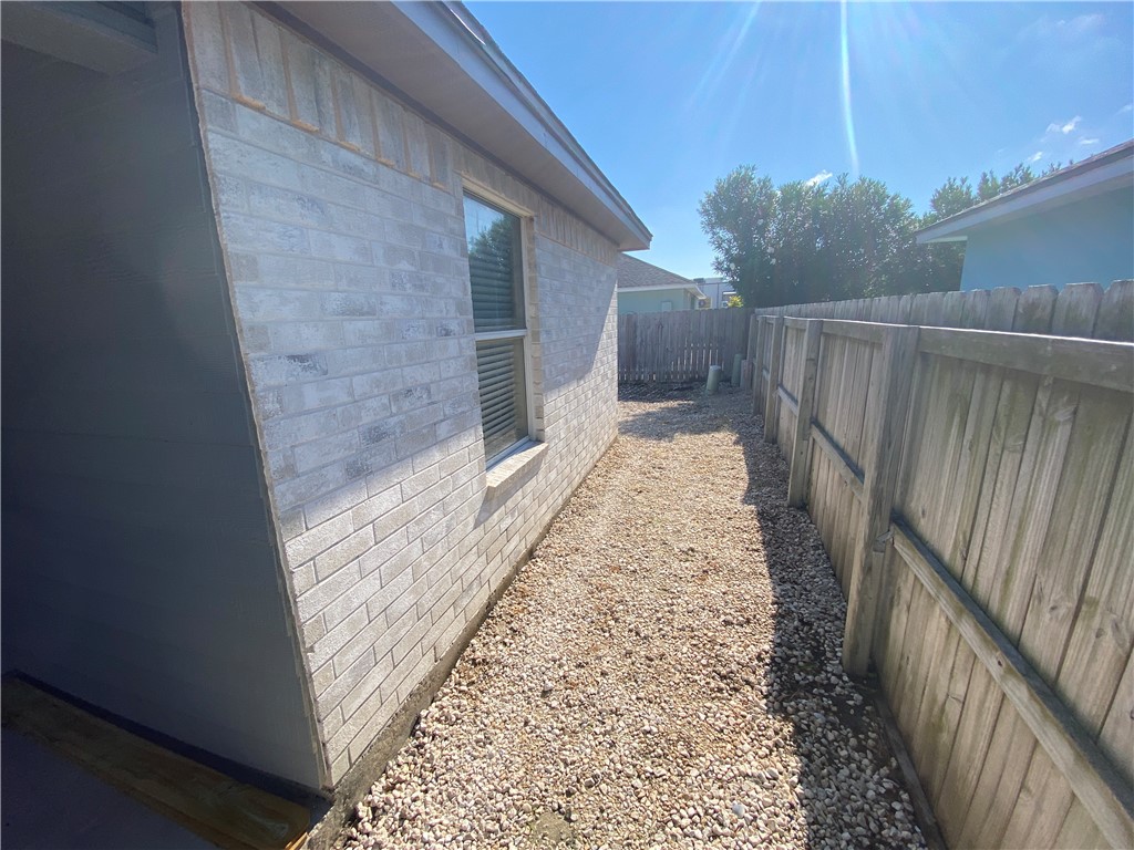 15410 Cruiser Street, Unit B Corpus Christi, TX 78418 - Photo 12 of 25 a view of a pathway of a house with wooden floor
