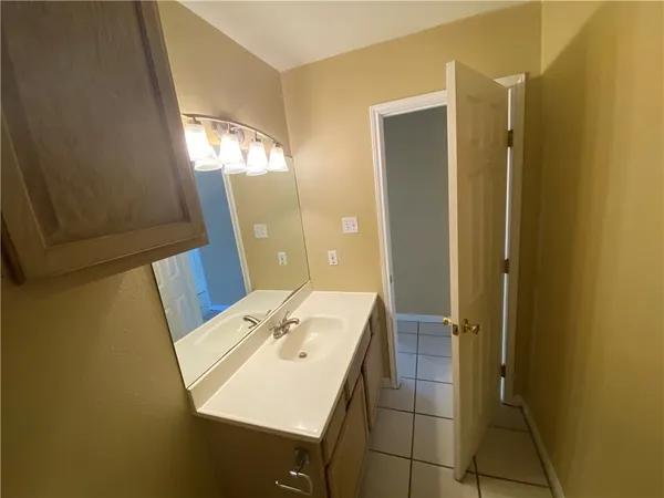 a view of an empty room with a fireplace