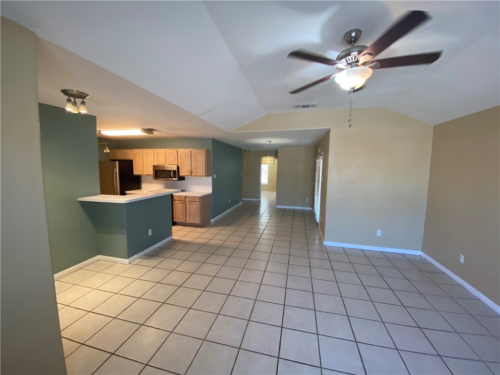 15410 Cruiser Street, Unit B Corpus Christi, TX 78418 - Photo 5 of 25 a view of a kitchen with a sink cabinets and window