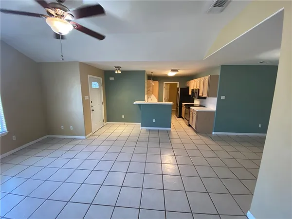 a kitchen with a sink appliances and cabinets