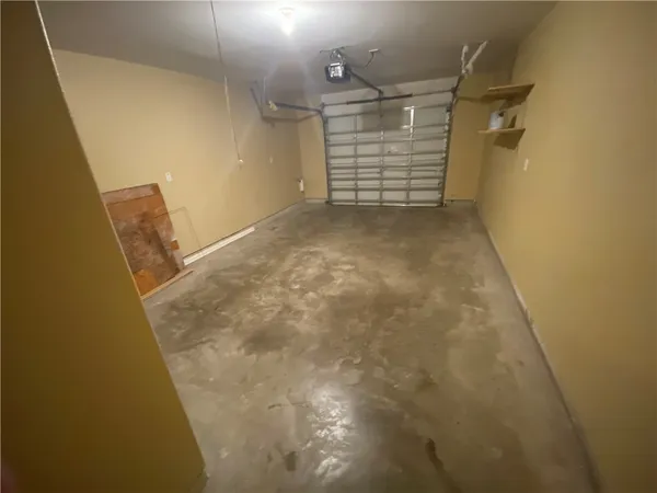 a view of a pathway of a house with wooden floor