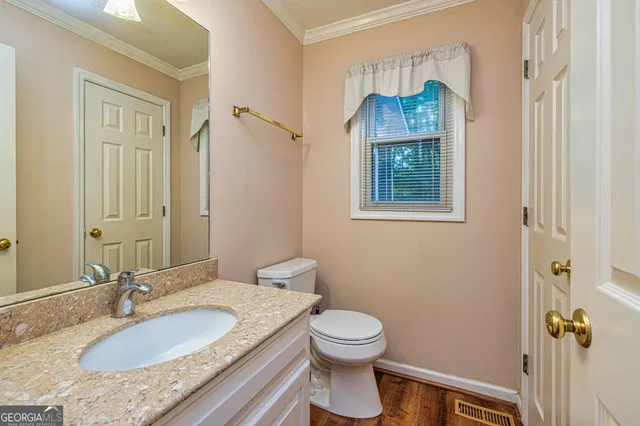 a kitchen with stainless steel appliances granite countertop a sink refrigerator and cabinets