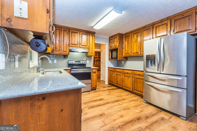 a utility room with a window a washer and dryer