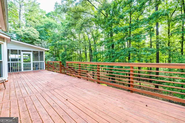 a bathroom with a toilet a sink and a mirror