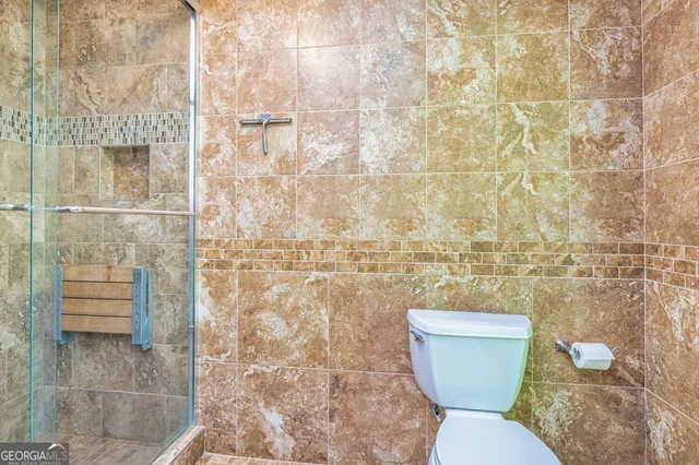 a living room with furniture a table and wooden floor