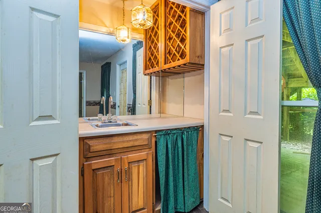 an aerial view of a house with a yard and lake view