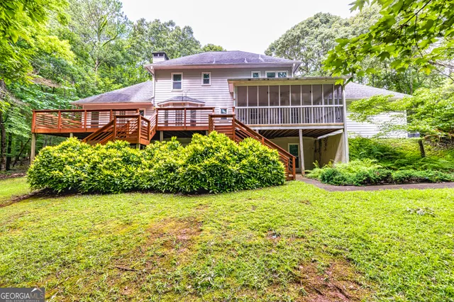 a view of a room with wooden floor and chandelier